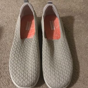 Tan Skechers slip on sneaker.